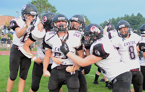 Canton players celebrate after scoring a touchdown on the final play of the game to beat Avon for the first time ever.