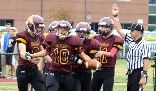 Granby's Matthew Holmes (10) celebrates with teammates after his interception with 1:54 left in the game. Holmes' field goal with 8 seconds won the game for Granby.