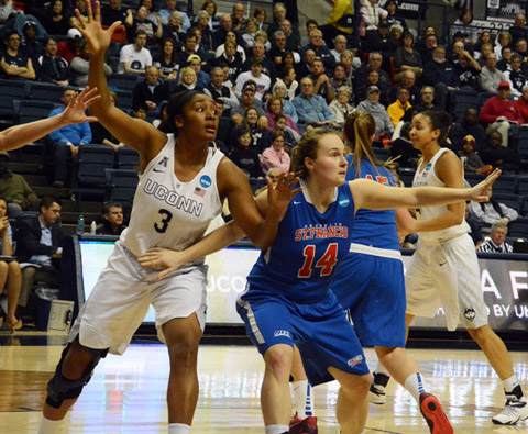 Canton's Saran Benedetti of St. Francis Brooklyn (14) battles for position with UConn's Morgan Tuck in Saturday night's NCAA Division I tournament game in Storrs.