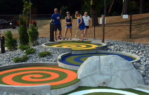 The Levesque family from Barkhamsted plays the hole in honor of the Hadron Collider in Geneva.