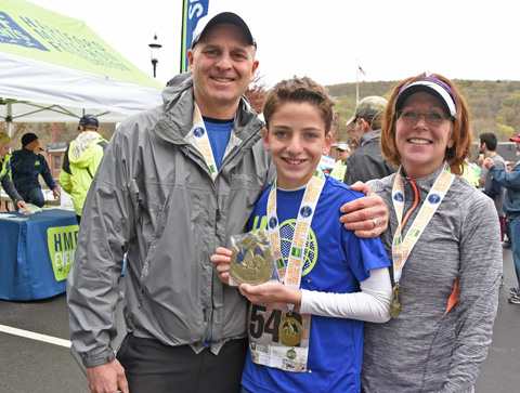 Avon's Larry Gliet, left, Matthew Gleit, center, and Paulette Gliet all ran in the Collinsville Classic 10K